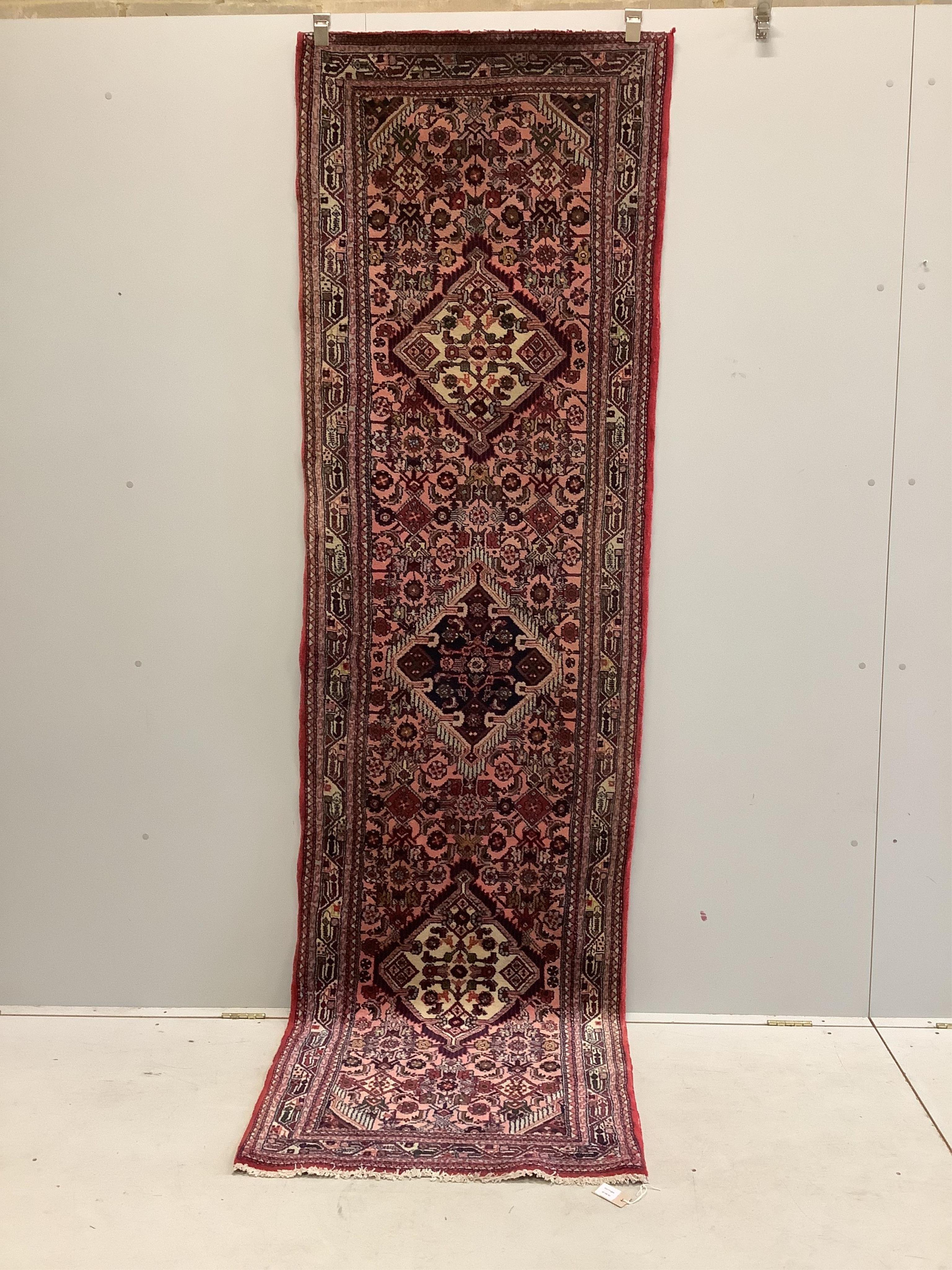 A North West Persian pink ground runner, 290 x 82cm. Condition - good